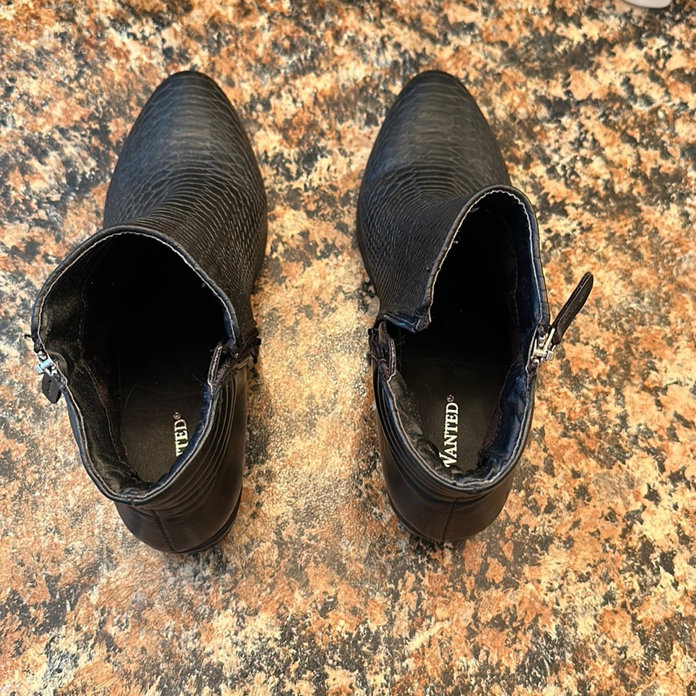 Women’s black booties, size 7.